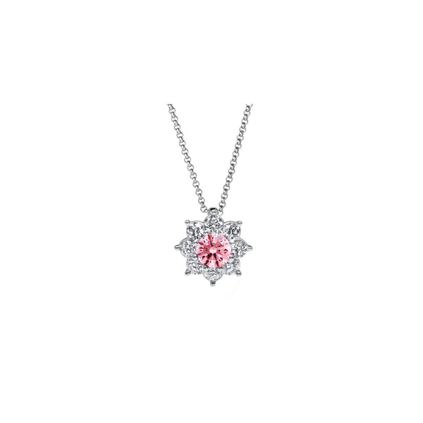 Pendentif avec une pierre de couleur couronné par huit pétales de diamants de culture qui apportent une touche fleurie et colorée.