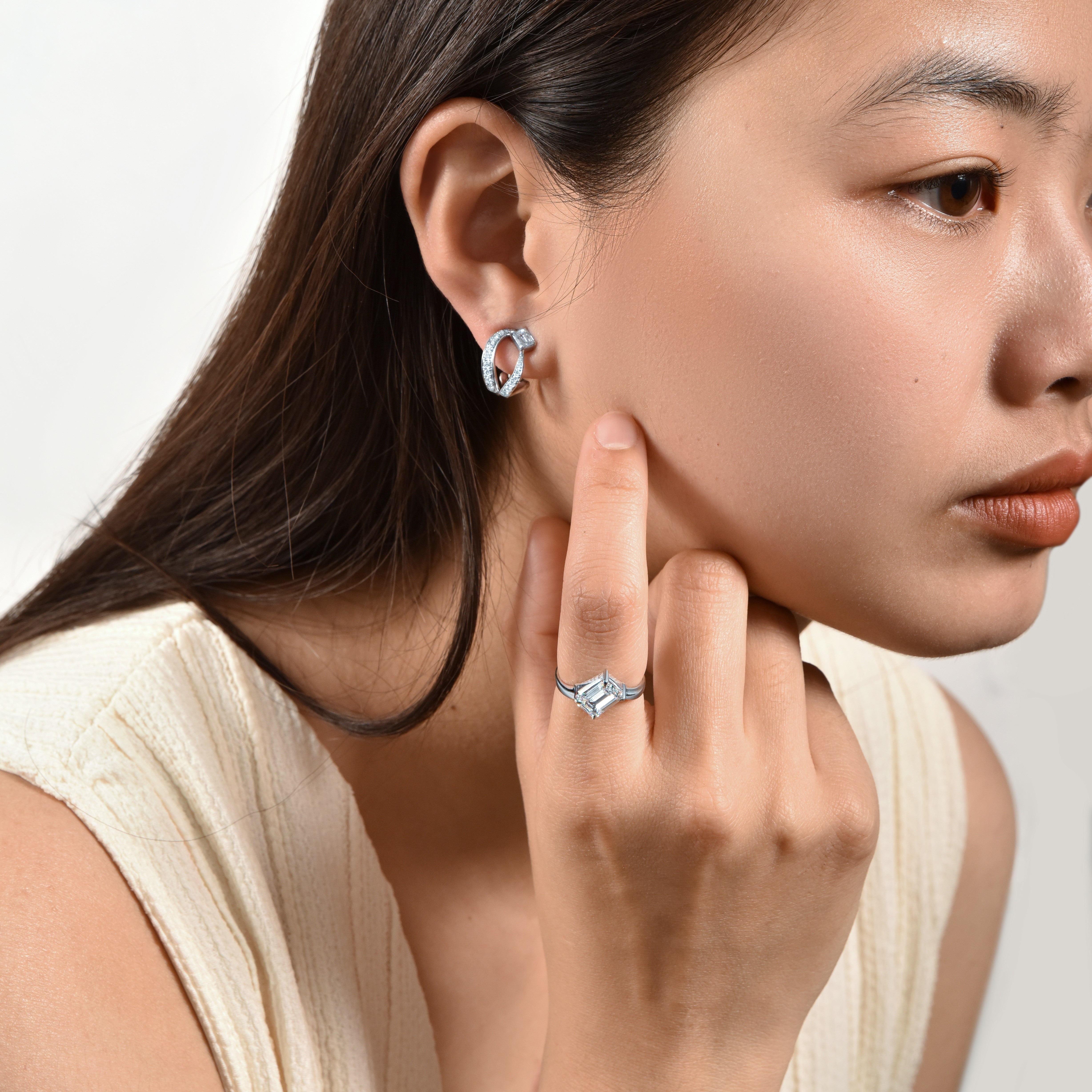 Ice Skating Girl earring with emerald cut diamonds