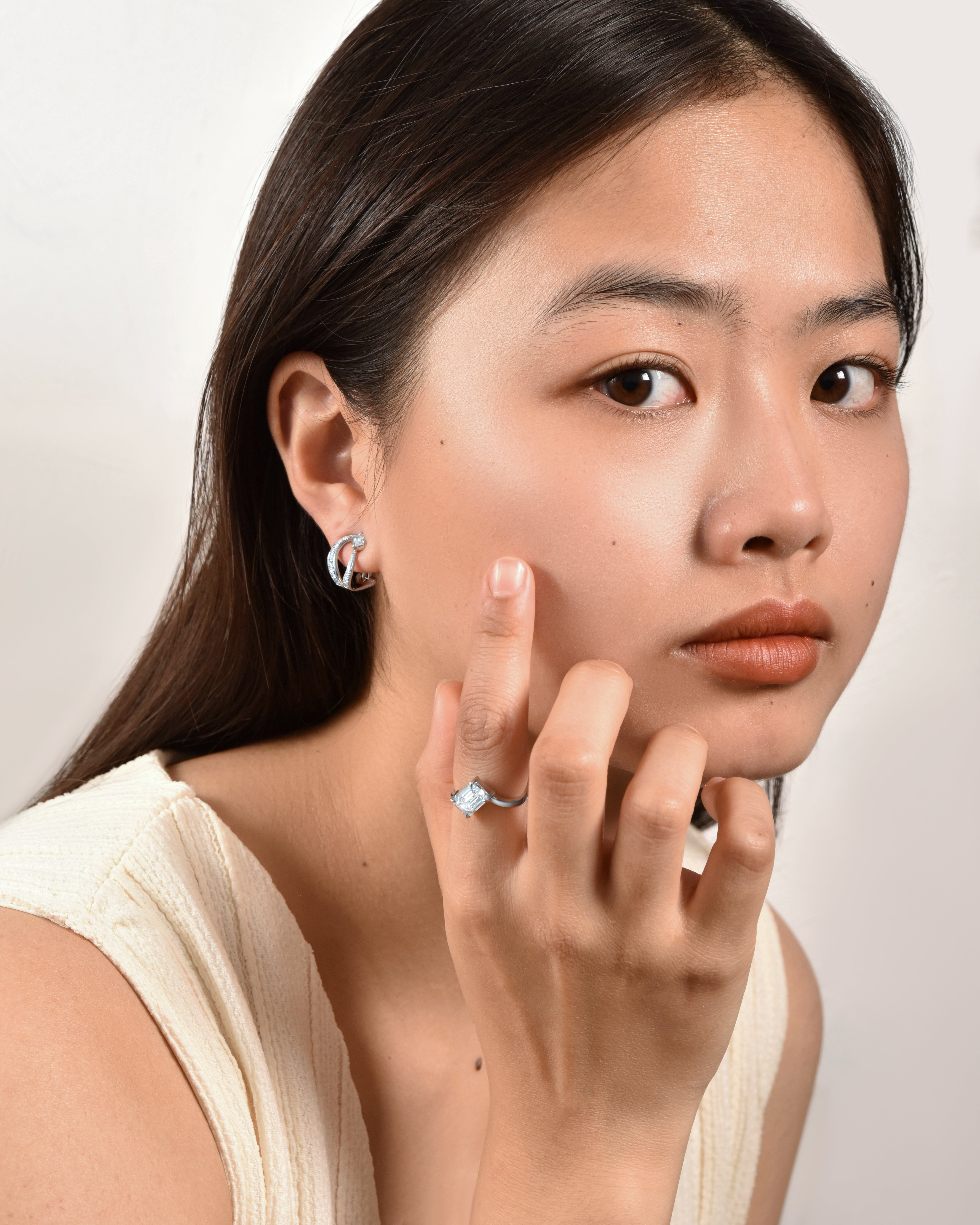Ice Skating Girl earring with emerald cut diamonds