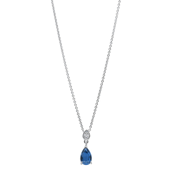 Collier en or 18 carats avec un saphir bleu royal taillé en forme de poire. La pierre est tenue par trois griffes et est accompagnée par une goutte en or sublimé de diamants en taille brillant.